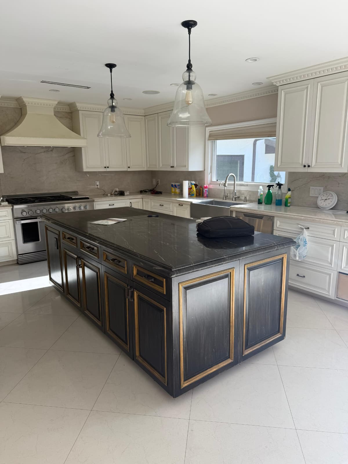 Refinished ivory kitchen cabinetry with brass hardware in Studio City