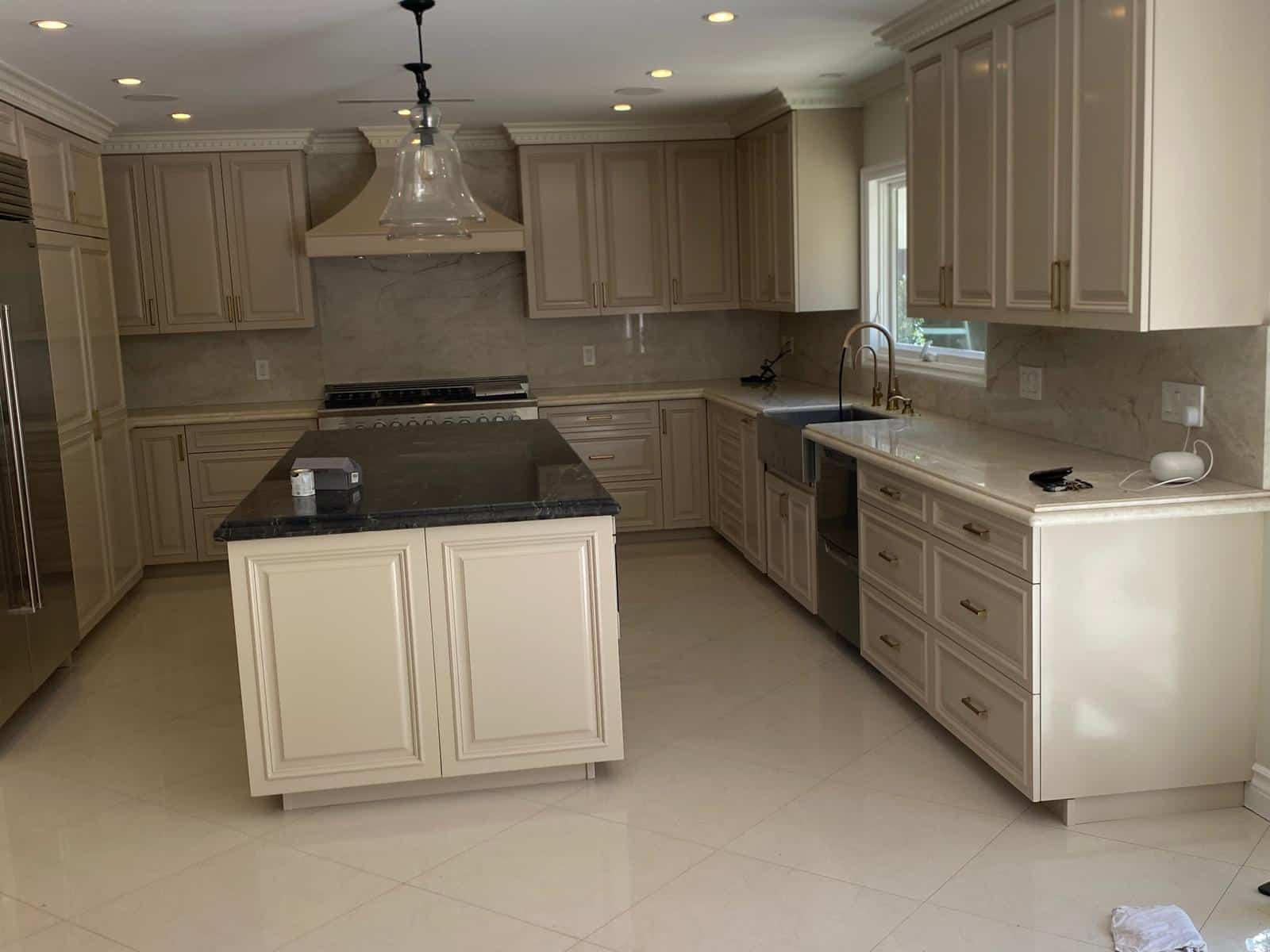 Refinished ivory cabinetry with brass hardware in Studio City