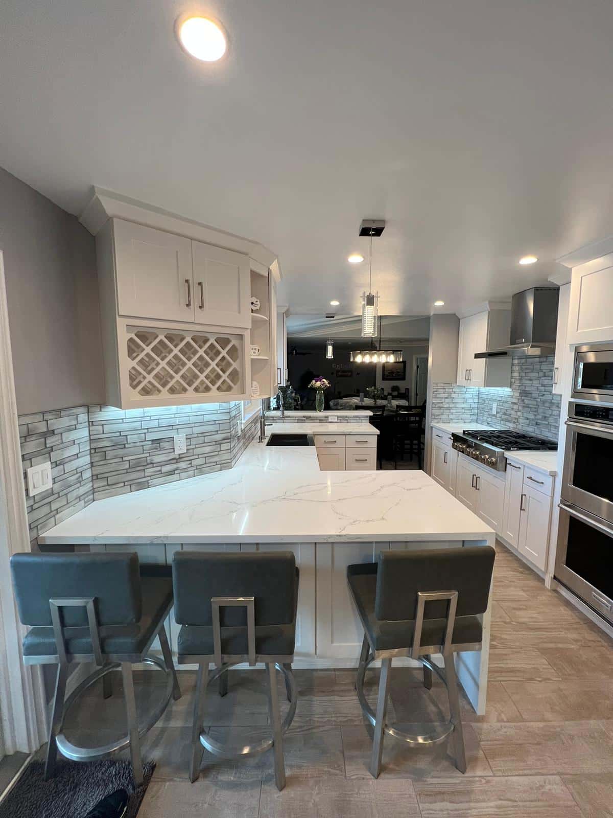 Completed kitchen remodel with quartz peninsula in Sherman Oaks