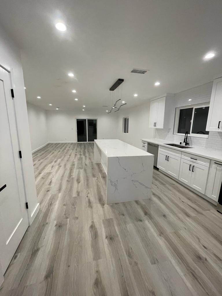 Waterfall quartz island in an open-plan kitchen, Canoga Park